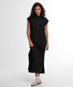 Lifestyle photo of the Women’s Sorona Long Extended Shoulder Dress in Black