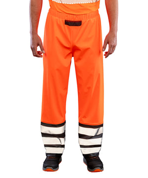 Lifestyle photo of the Heavy-Duty Prism PU Safe and Dry Trousers with Recycled Backing in Fluorescent Orange/Black