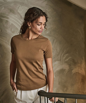 Lifestyle photo of the Women’s Interlock Tee (580)