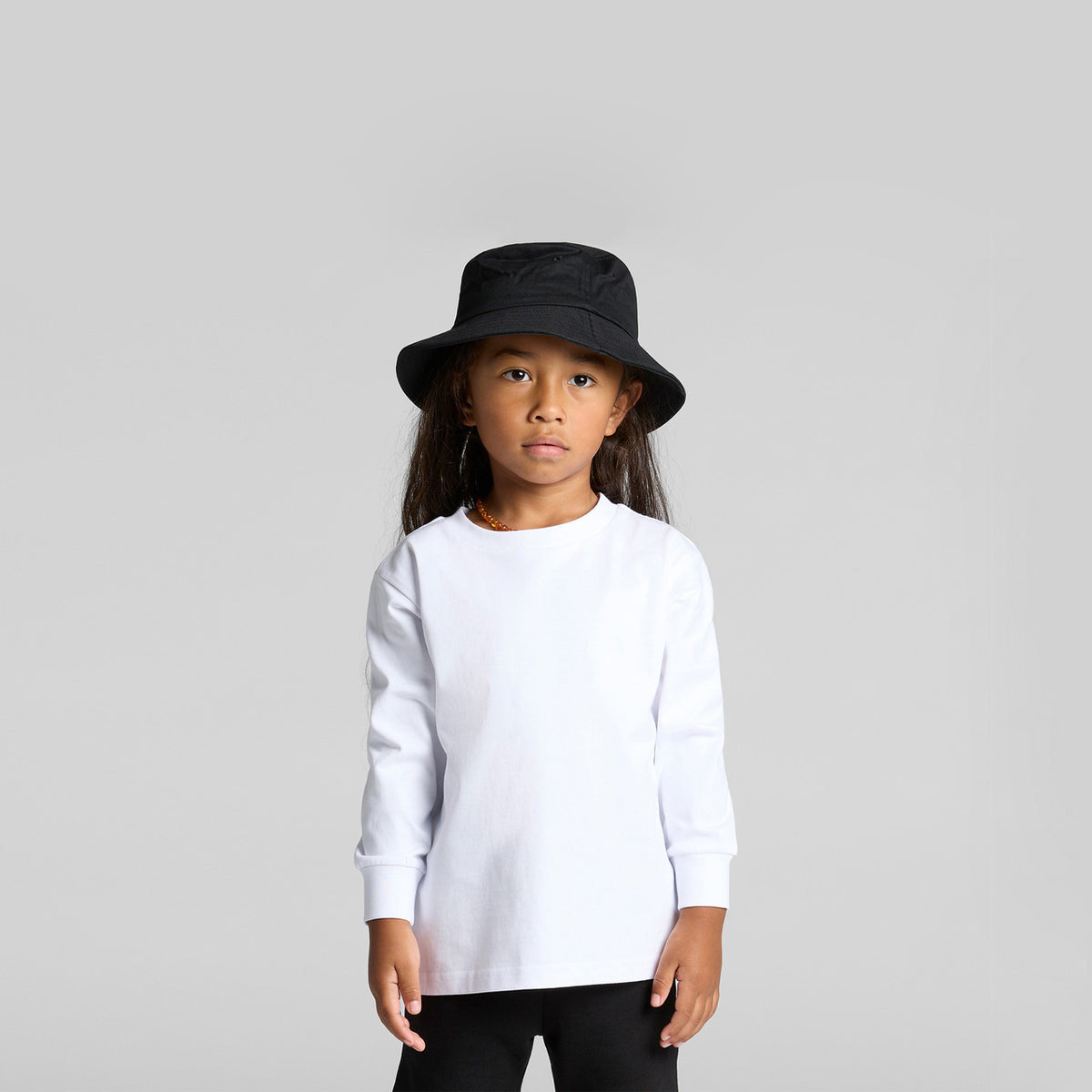 Lifestyle photo of the Kids Classic L/S Tee (AS3062) in Black (1)