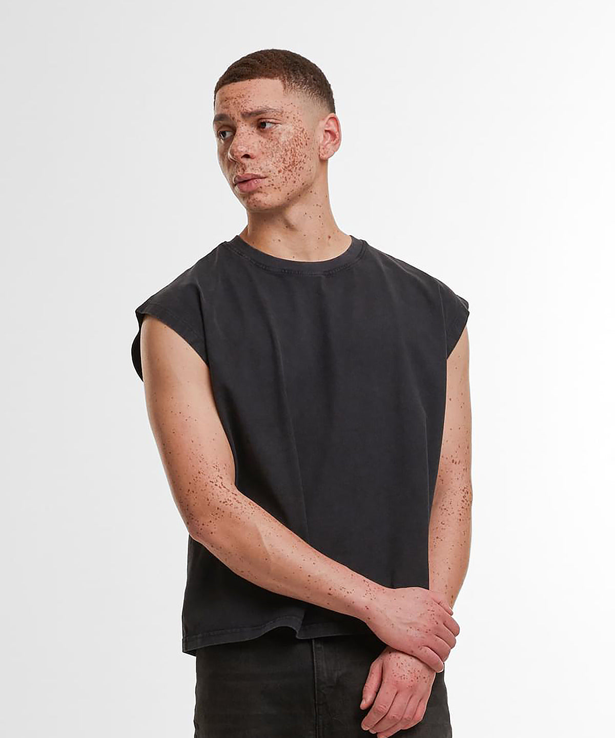Lifestyle photo of the Vintage Cropped Heavy Sleeveless Tee