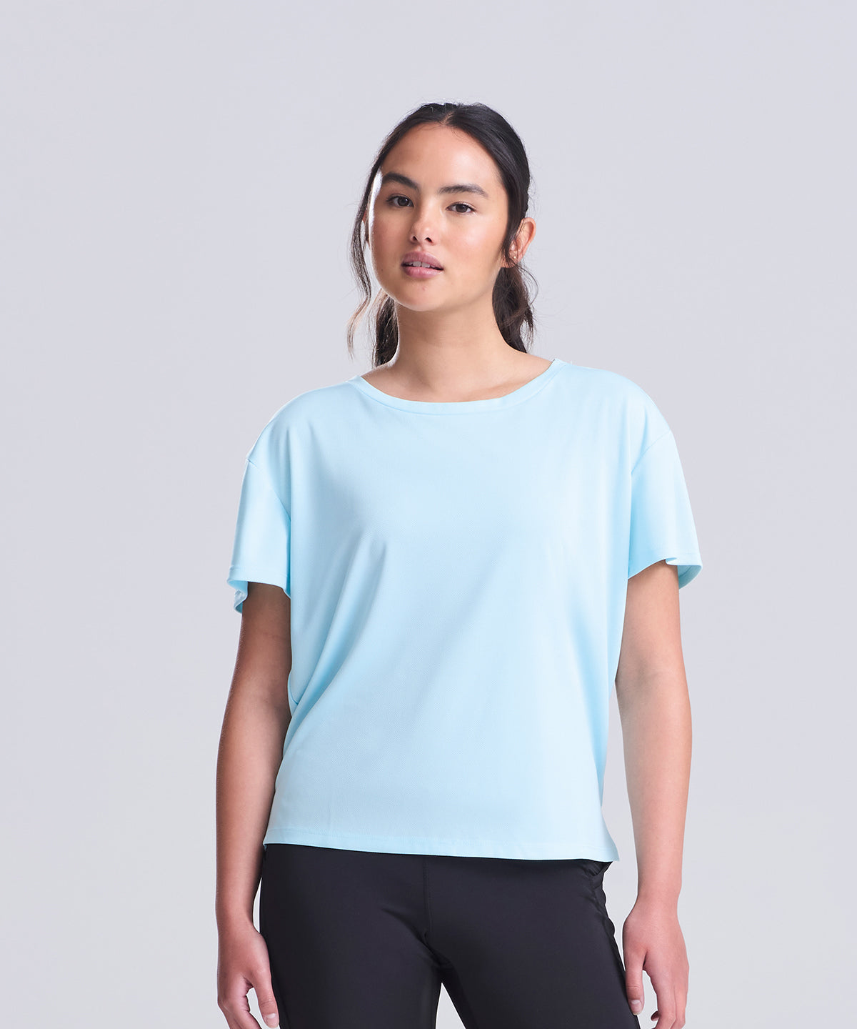 Lifestyle photo of the Women’s Open Back T