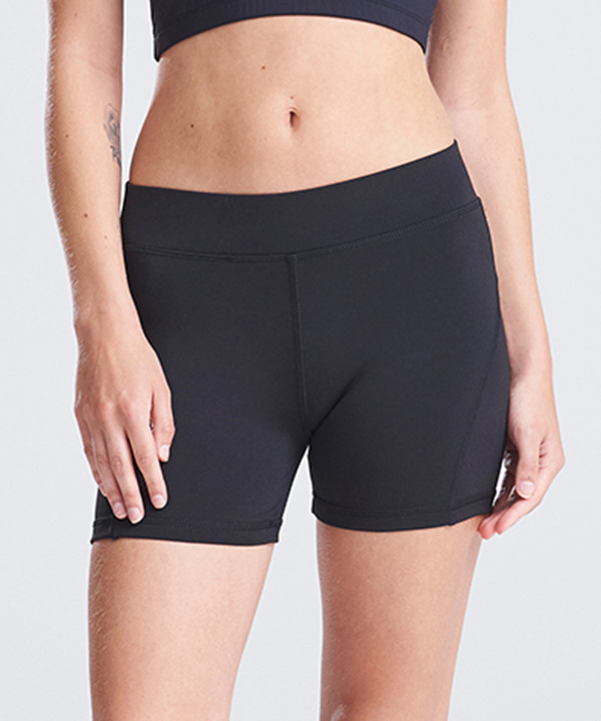 Lifestyle photo of the Women's Cool Training Shorts in Jet Black