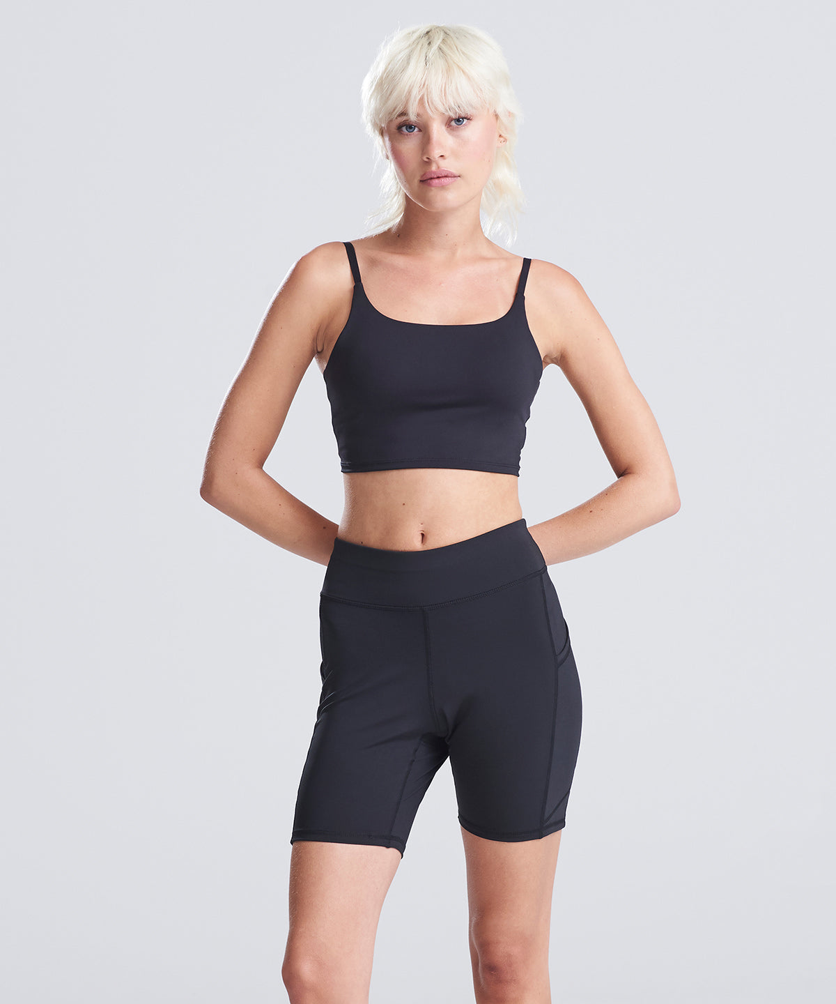 Lifestyle photo of the Women’s Recycled Tech Shorts in Jet Black