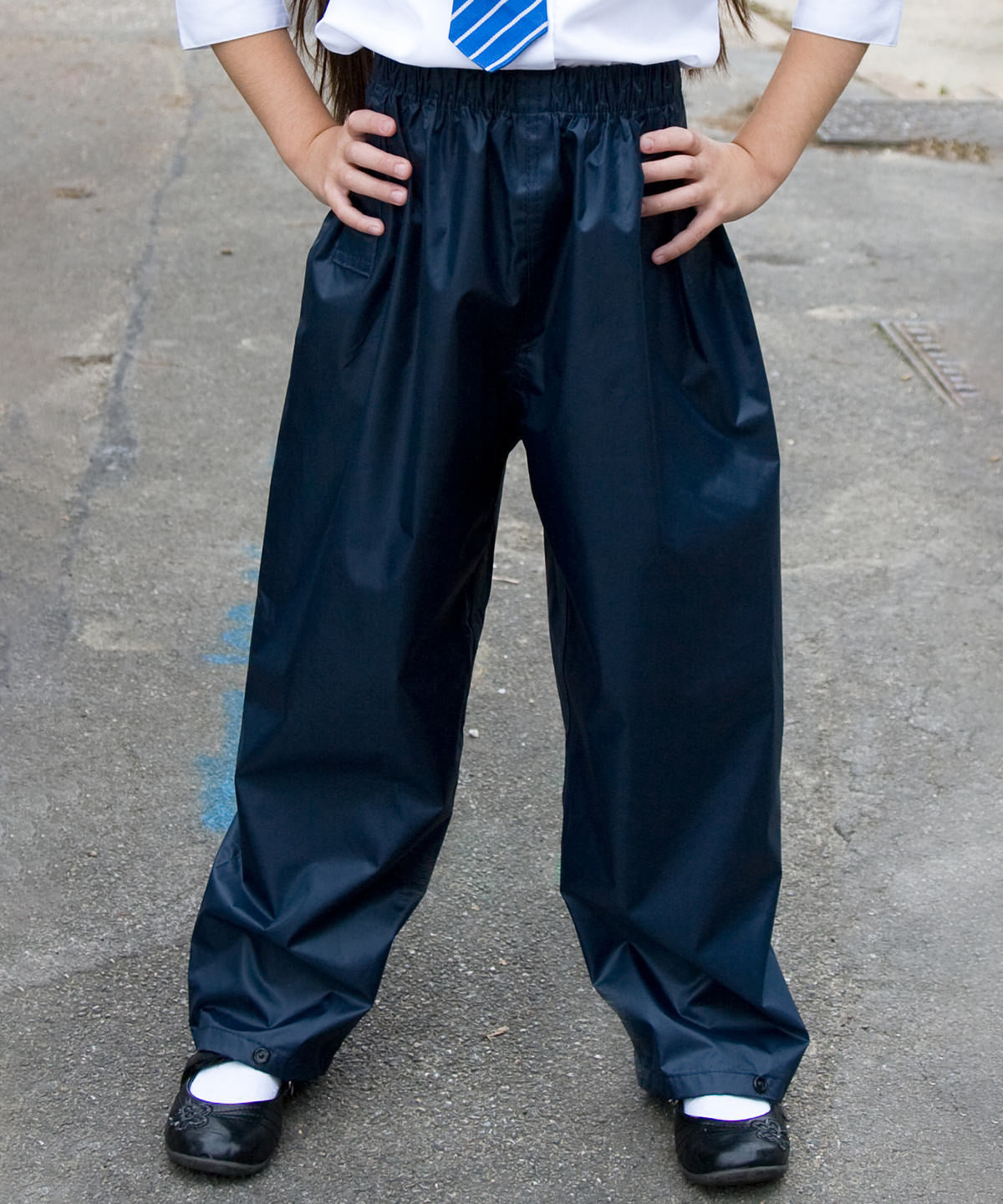 Lifestyle photo of the Core Junior Rain Trousers