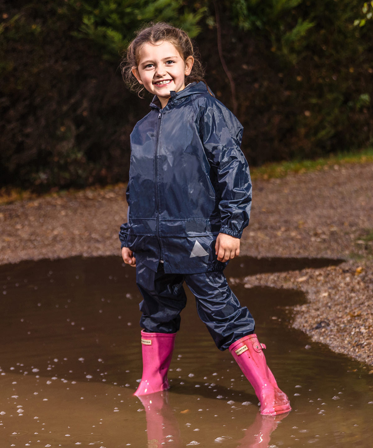 Lifestyle photo of the Junior Waterproof Jacket and Trouser Set