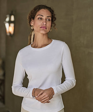 Lifestyle photo of the Women’s Long Sleeve Interlock Tee (590)