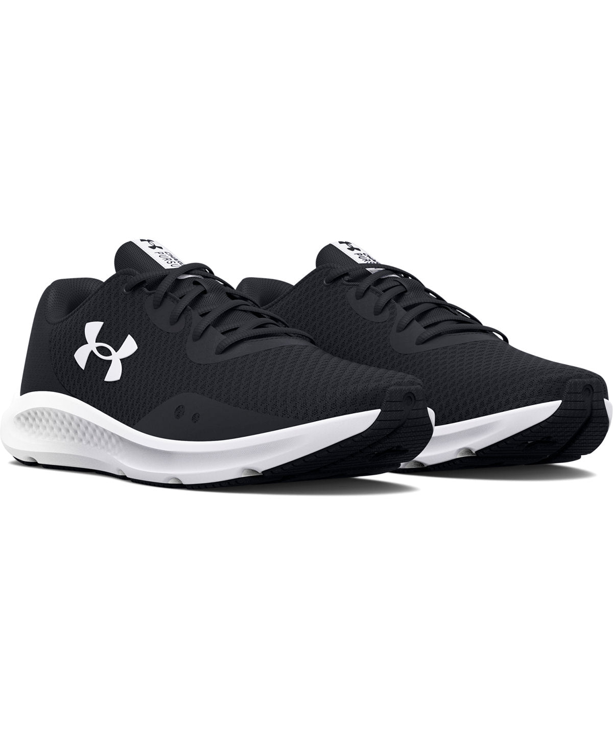 Lifestyle photo of the UA Women's Charged Pursuit 3 Trainers in Black