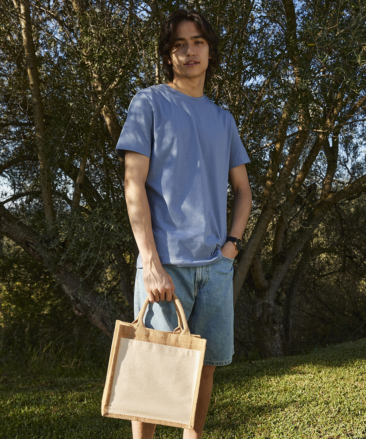 Lifestyle photo of the Cotton Pocket Jute Midi Tote in Natural